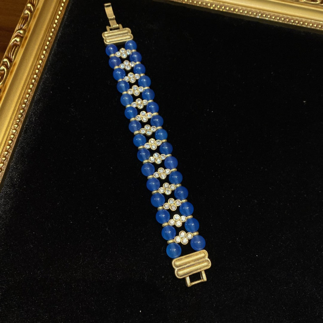 Vintage style 18k-gold plated brass bracelet with blue natural stone beads and rhinestones.