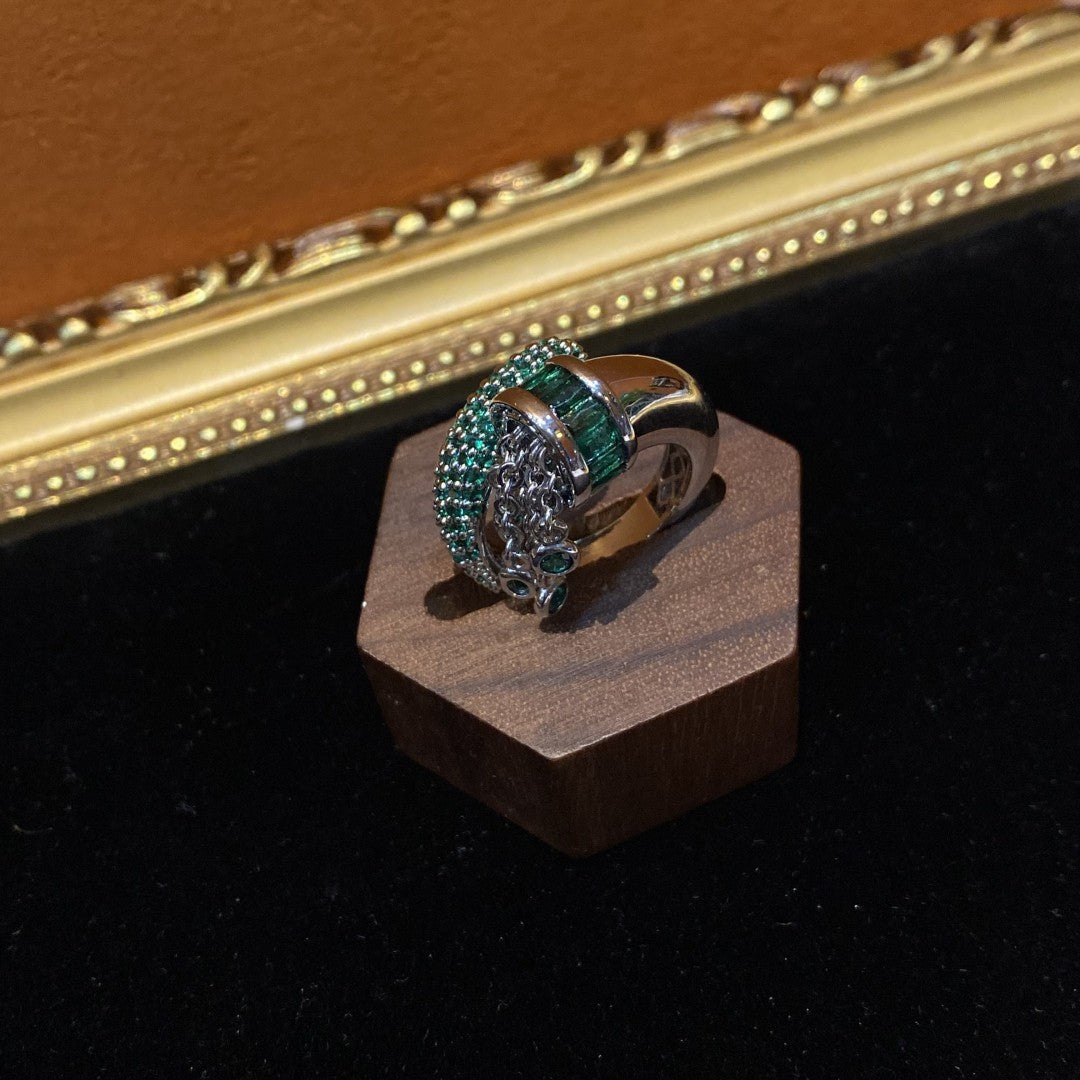 Vitatge style 18k-gold plated brass ring with green rhinestones and a tessel
