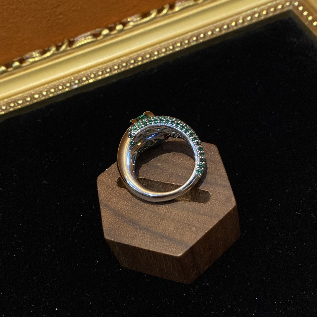 Vitatge style 18k-gold plated brass ring with green rhinestones and a tessel