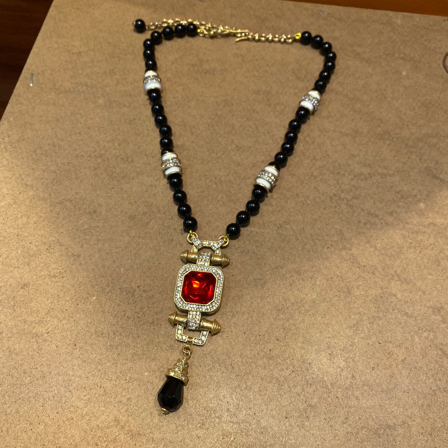 Vintage style designed brass adjustment 18k-gold plated necklace with black natural stone beads with a red rhinestone denpant
