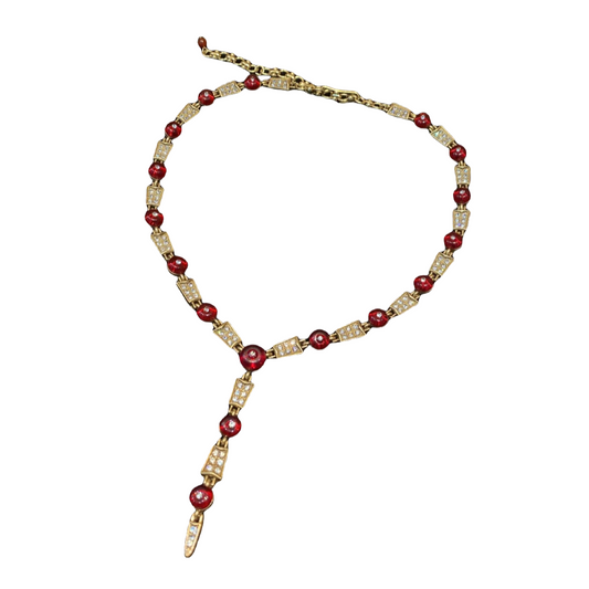 Vintage style designed brass 18k-gold plated denpant adjustable gorgerous necklace with red colored glaze and serveral rhinestones.